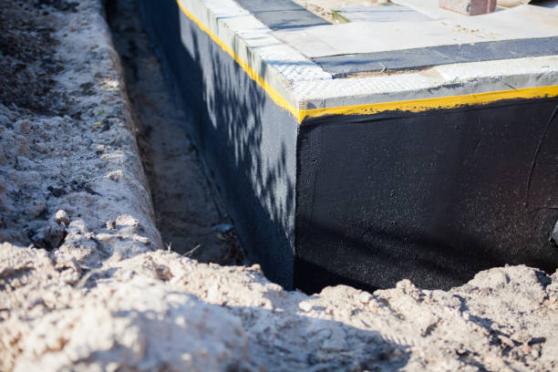 Professional Waterproofing technician working in Liverpool, NY